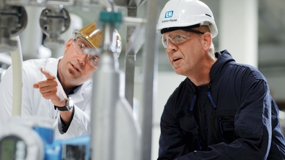 Customer with Endress+Hauser engineer in a plant.