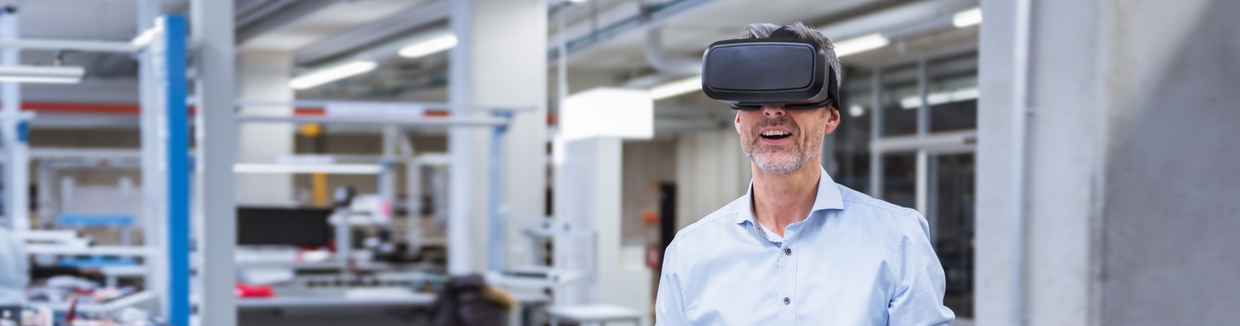 Man in an office with virtual reality glasses